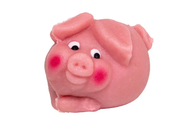 Marzipan sweetness isolated. Close-up of a pink pig made from ma — Stock Photo, Image