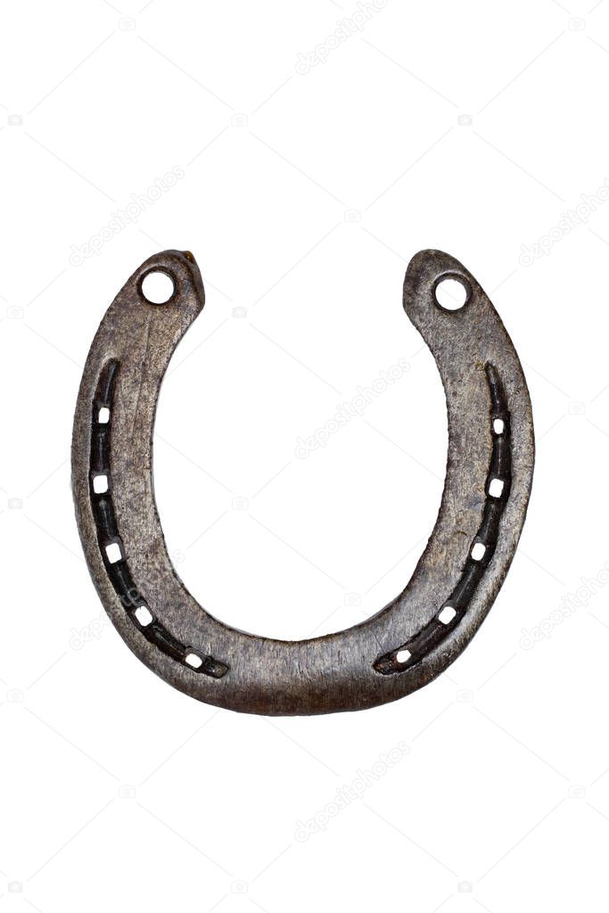 Horseshoe isolated. Close-up of metal horse shoe as a symbol of 