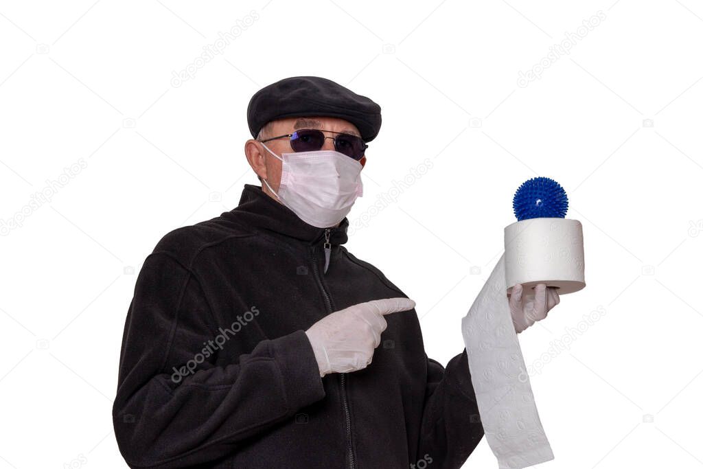 Coronavirus quarantine cocept. Man with surgical mask, hood, glasses and medical gloves shows a roll of toilet paper with an abstract model of a virus covid-19 on it isolated on a white background.