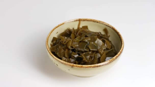 Kelp salad in a ceramic bowl. — Stock Video