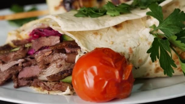 Shawarma is a dish in Middle Eastern cuisine consisting of meat and vegetables. — Stock Video