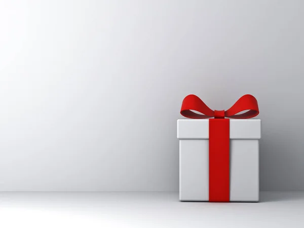 Caja regalo regalo con lazo de cinta roja sobre fondo de pared blanco con sombra —  Fotos de Stock