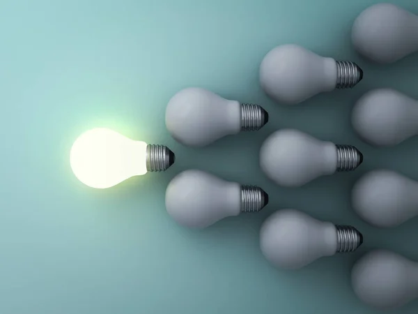 One glowing light bulb standing out from the unlit incandescent bulbs on green background , leadership and different concept — Stock Photo, Image