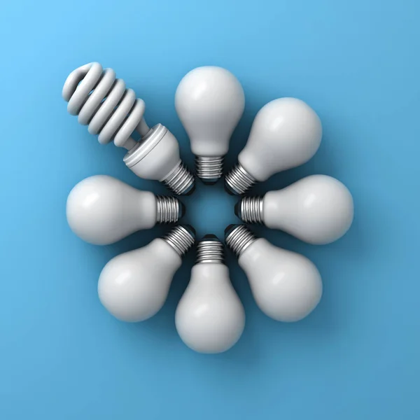 Bombilla de ahorro de energía, una bombilla fluorescente compacta entre bombillas incandescentes sobre fondo azul — Foto de Stock