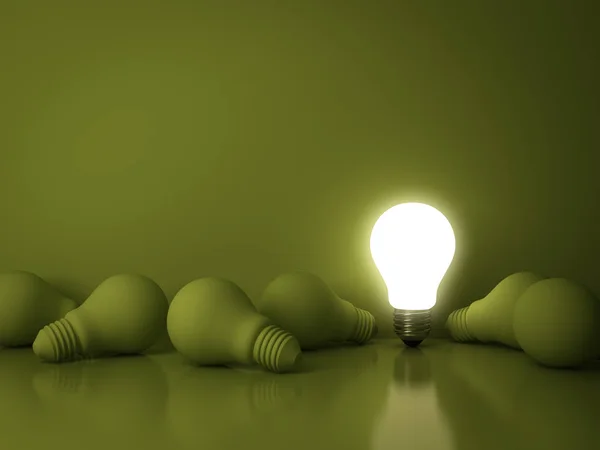 One glowing light bulb standing out from the dead incandescent bulbs on green background with reflection , individuality and different creative idea business concept — Stock Photo, Image