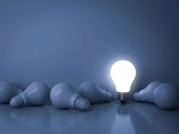 One glowing light bulb standing out from the unlit incandescent bulbs on blue background with reflection , individuality and different creative idea business concept — Stock Photo, Image