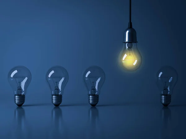 One hanging light bulb glowing from unlit incandescent bulbs on dark blue background with reflection , stand out from the crowd, leadership and different business creative idea concept — Stock Photo, Image