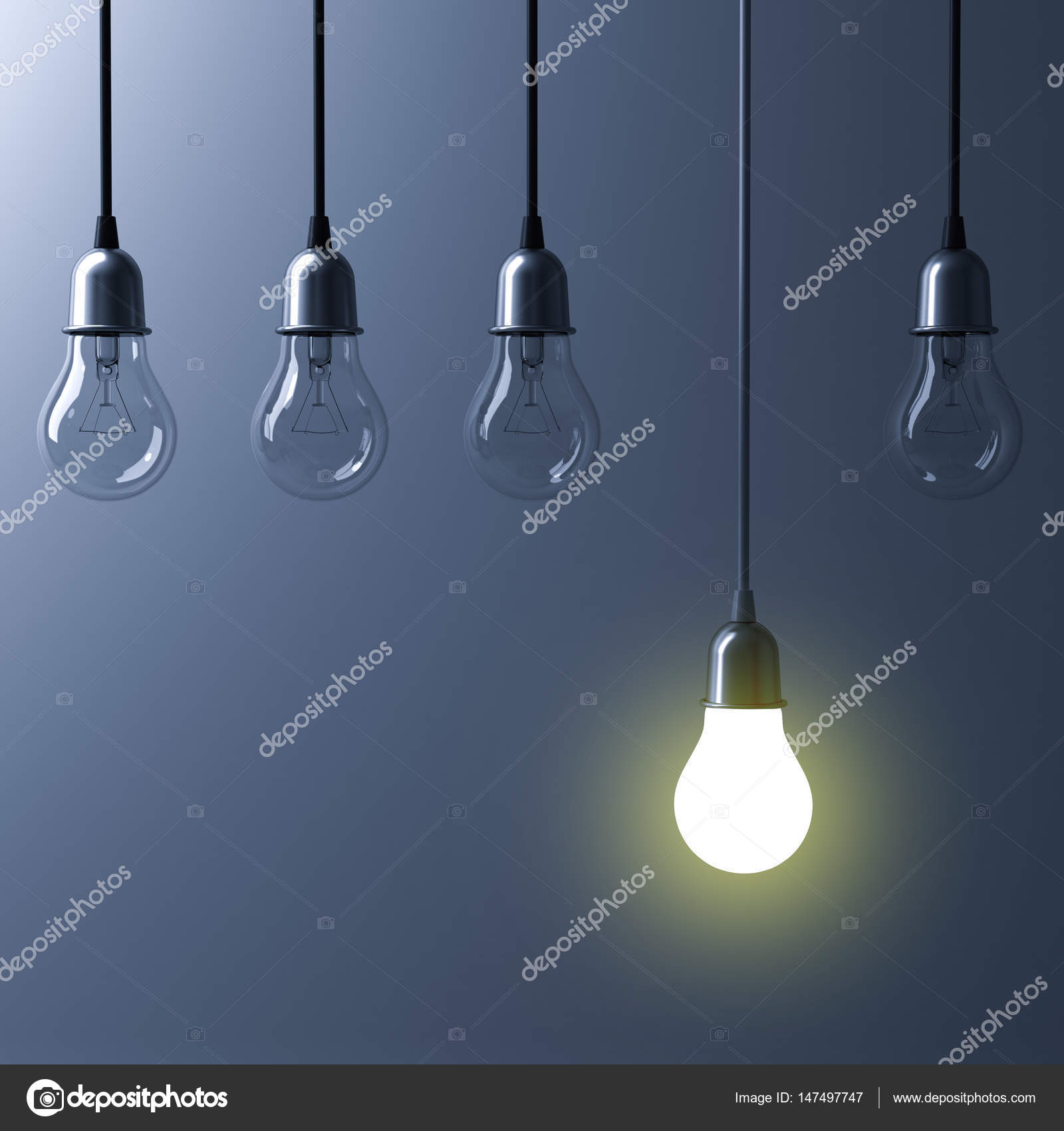 One Hanging Light Bulb Glowing Different And Standing Out From