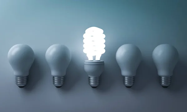 Energy saving light bulb , one glowing compact fluorescent lightbulb standing out from unlit incandescent bulbs on cyan background , individuality and different creative idea concepts . 3D render — Stock Photo, Image