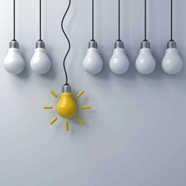 Think different concept , One hanging yellow idea bulb standing out from the dim unlit light bulbs on white wall background , leadership and individuality creative idea concepts . 3D rendering.