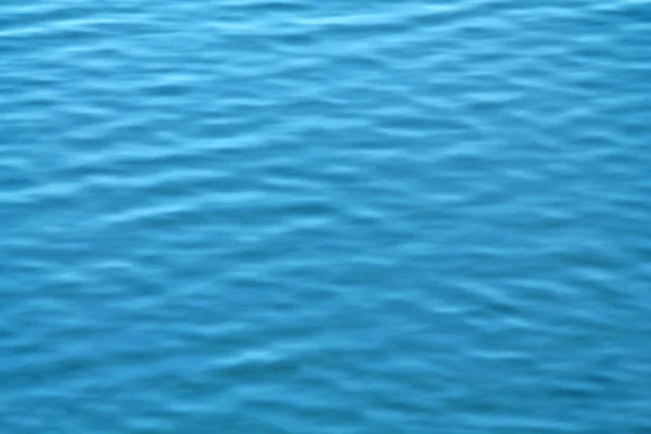 Abstract blue water background with shallow waves — Stock Photo, Image