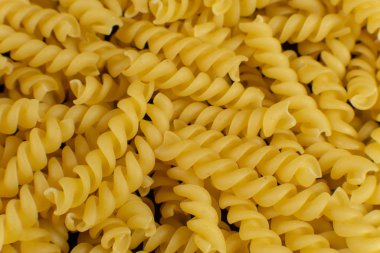 Arkaplan spiral şekilli makarna tarafından oluşturuldu. doku.