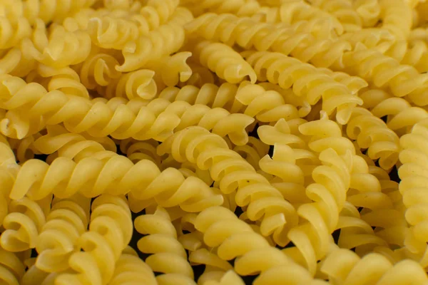 Arkaplan spiral şekilli makarna tarafından oluşturuldu. doku.