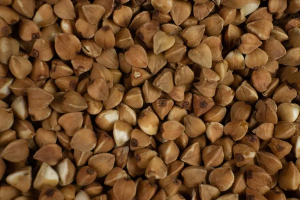 Hintergrund und Textur von Buchweizen. Buchweizen geröstet. Garnieren. Zutat. Diätprodukt. — Stockfoto