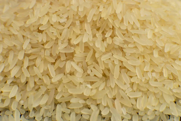 Fondo de arroz blanco de grano largo. Macro. Textura de arroz. Vista superior — Foto de Stock