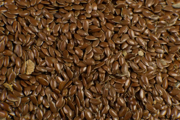 Brown Flax seed. Also known as Linseed, Flaxseed and Common Flax. Closeup of grains, background use. — Stock Photo, Image