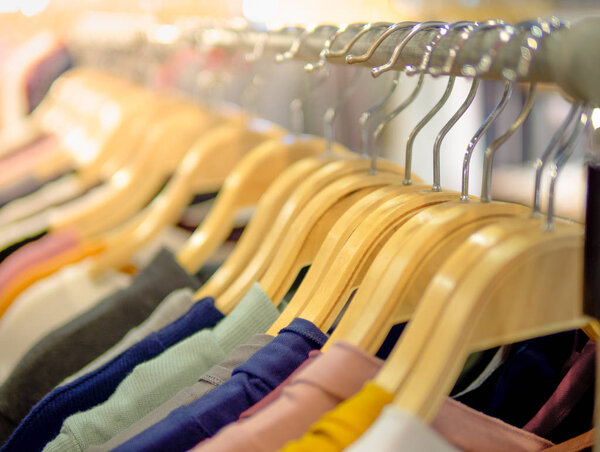 Wooden Clothes on Hanger with Woman Boutique Shirt at The Modern Shop