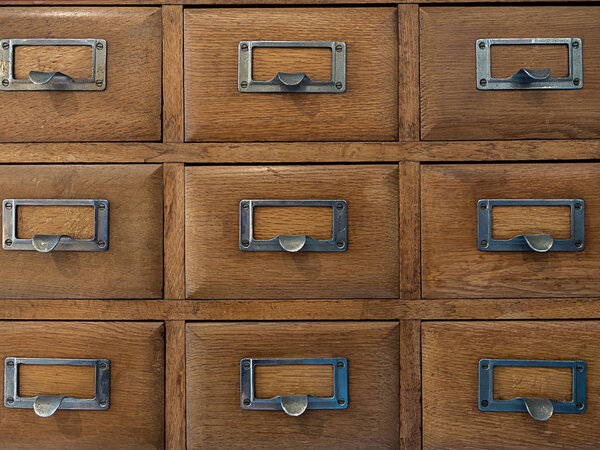 Old vintage wooden library card catalog cabinets.