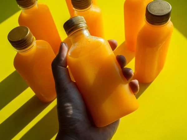 Orange Juice Iced Cold Bottles Hand Holding Square Shape Bottle — Stock Photo, Image