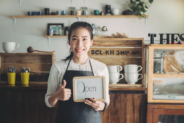 Portrait Asian woman business owner with bakery shop background