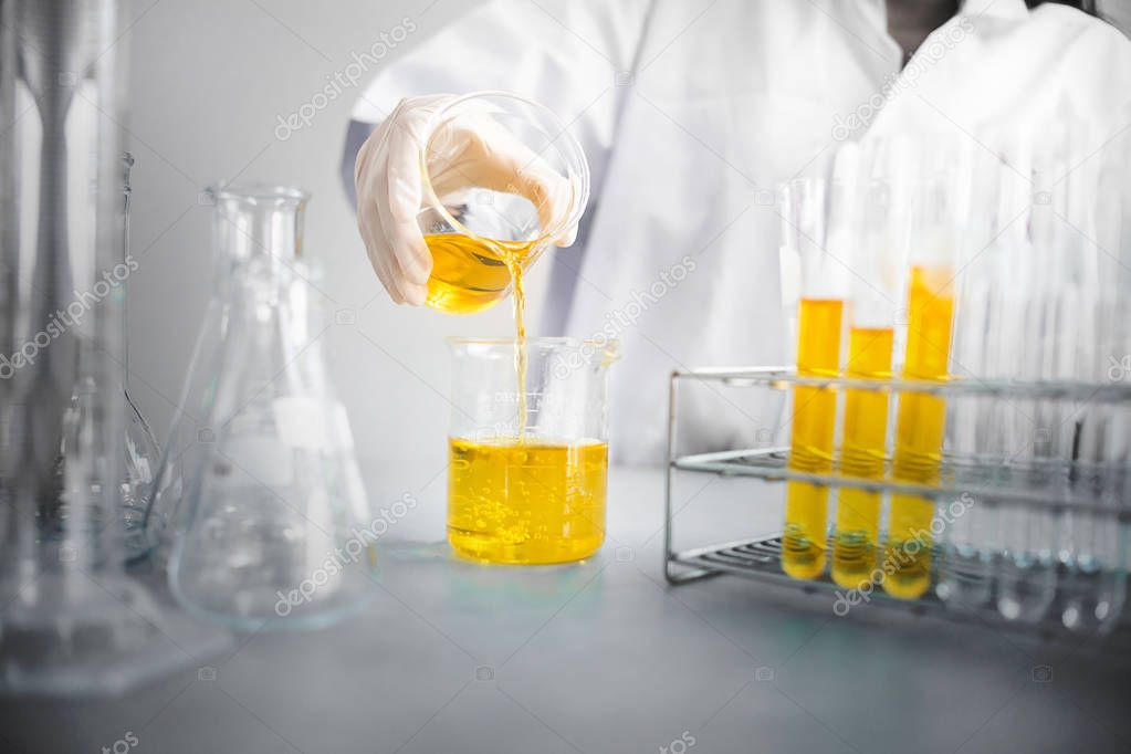 Oil pouring, Formulating the chemical for medicine,Laboratory research, dropping liquid to test tube