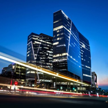 Johannesburg, South Africa, March 29-2018: City street with modern buildings in skyline. Long exposure of city street. clipart
