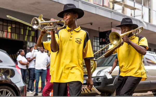 Johannesburg, South Africa, April 29-2018: Buskers playing on the streets. Brass band performing in the city.