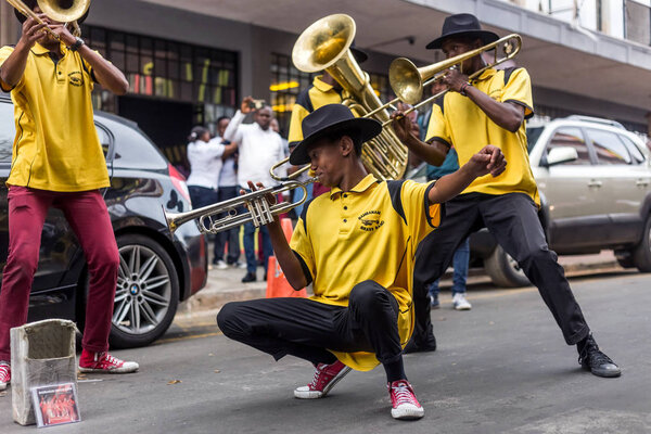 Johannesburg, South Africa, April 29-2018: Buskers playing on the streets. Brass band performing in the city.