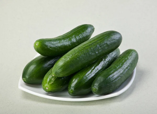 Cucumber on white plate — Stock Photo, Image