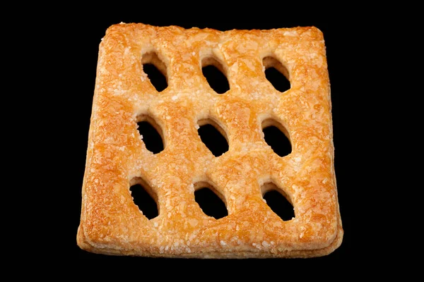 Quadratischer Perforierter Keks Isoliert Auf Schwarzem Hintergrund — Stockfoto