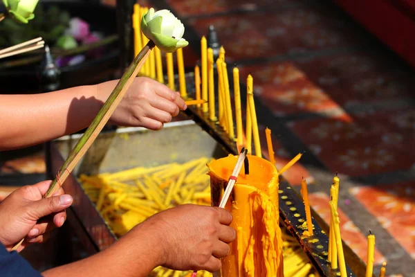 Incense sticks and burning candles. Traditional Thailand buddhist concept.