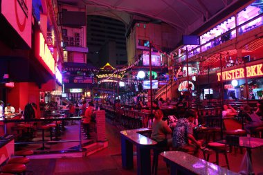 Nana Plaza, the biggest red light district and entertainment complex with go-go bars in Bangkok. clipart