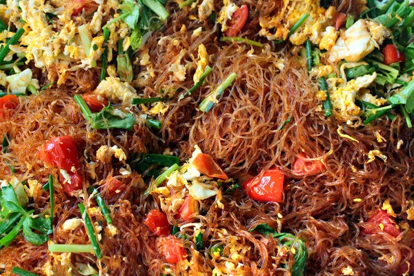Stir-fried noodles with eggs and vegetables in Bangkok, Thailand