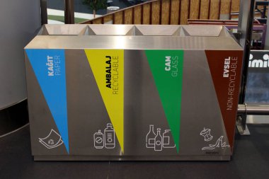 Istanbul, Turkey - November 28, 2019: Four garbage bins for different sorts of waste in new Istanbul Airport. The main international airport serving Istanbul was opened in 2018.