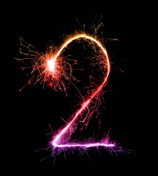 2. dígito dois feitos de fogos de artifício sparklers à noite — Fotografia de Stock