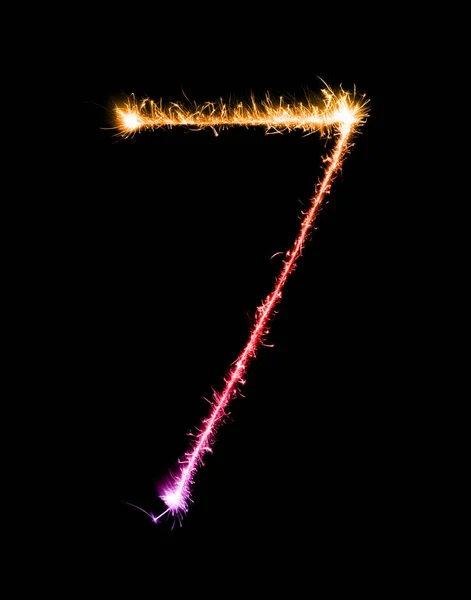 7. számjegy, hét készült csillagszórók tűzijáték éjjel — Stock Fotó
