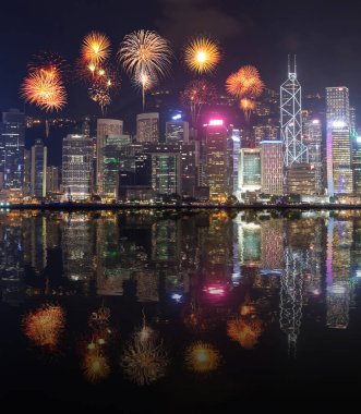 Fireworks Festival over Hong Kong city with water reflection clipart