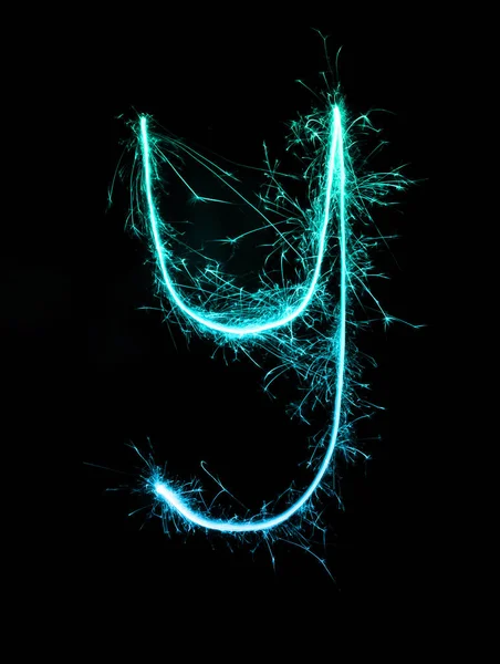 Tomtebloss fyrverkeri ljus alfabetet y (små bokstäver) på natten — Stockfoto