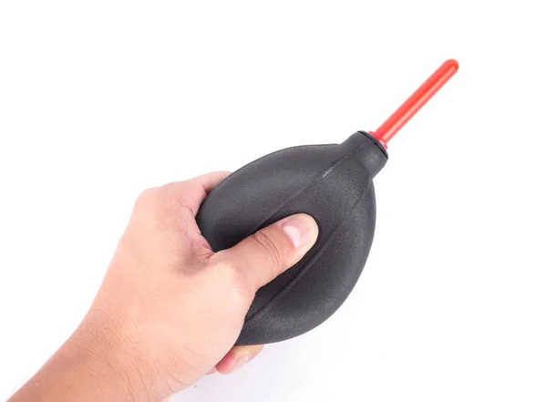 Hand holding air dust blower for camera cleaning isolated on whi — Stock Photo, Image