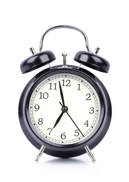 7 O 'Reloj despertador aislado en blanco Imágenes de stock libres de derechos