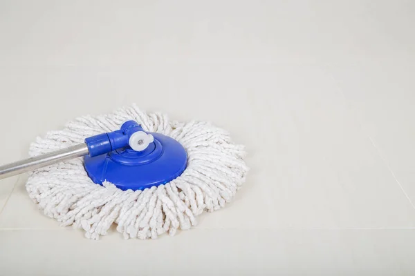 Mop for cleaning with floor background — Stock Photo, Image