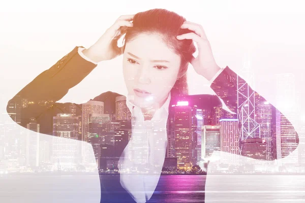Double exposure of  business woman worried with city background — Stock Photo, Image