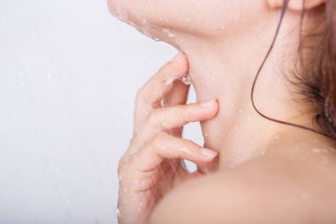 hand with neck of woman which take a shower clipart