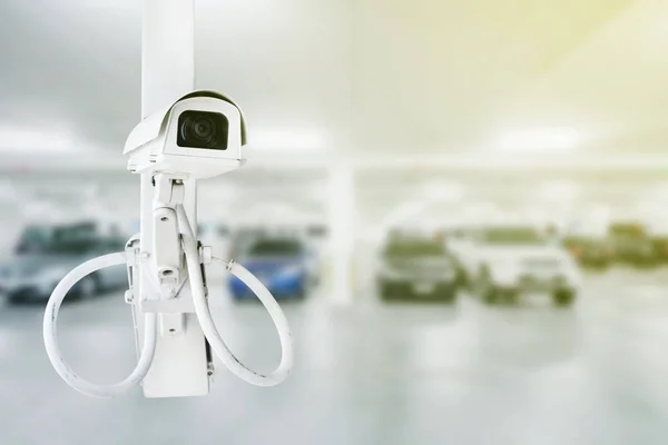 CCTV security camera with car parking background — Stock Photo, Image