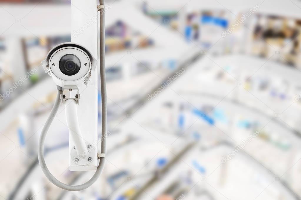 CCTV security camera with shopping mall background