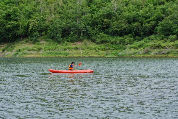 Man paddling in a kayak boat in Thailand — Stock Photo, Image