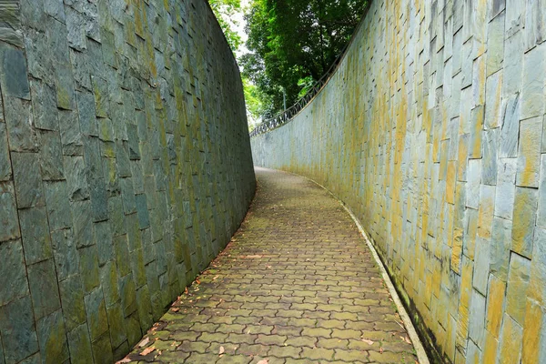 Stone walk way in tunnel at Fort Canning Park, Singapore — Stock Photo, Image