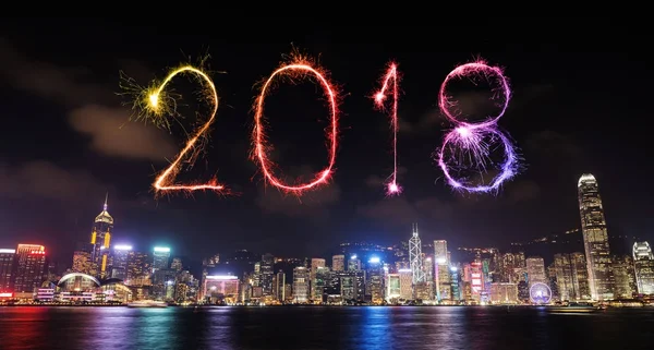 2018 Happy new year firework Sparkle with Hong Kong cityscape