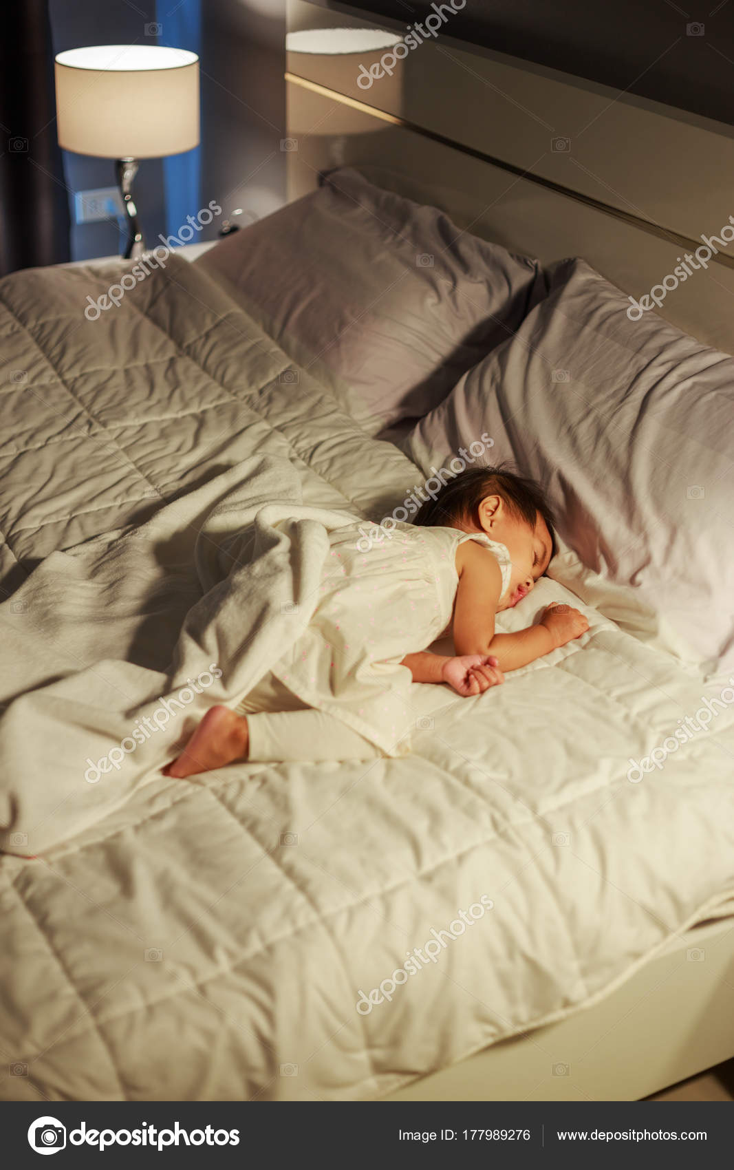 Baby sleeping on bed at home — Stock Photo © geargodz 177989276