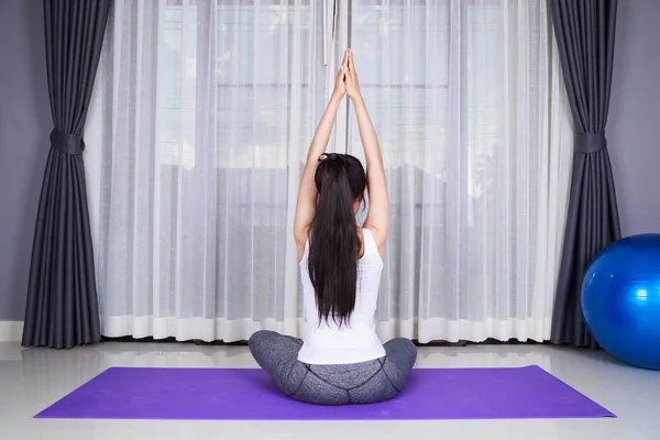 Woman doing yoga exercise isolated on white background — Stock Photo, Image